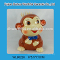 Ceramic monkey figurine utensil holder for kitchen